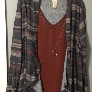 A dress shirt  with necklace attached to it